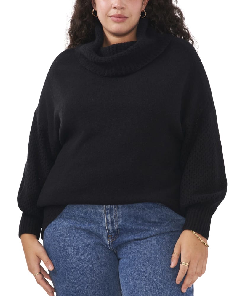 Front of a model wearing a size 1X Brenna Drop Shoulder Turtleneck Sweater in RICH BLACK by Vince Camuto. | dia_product_style_image_id:261388